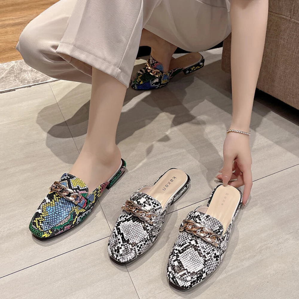 Elevate your footwear game with our Classic Square Toe Slides. Featuring an elegant square-toe design, these stylish slides are perfect for any fashion-forward woman. With a classic style and modern touch, these designer slide sandals are a must-have for your casual and chic wardrobe.
