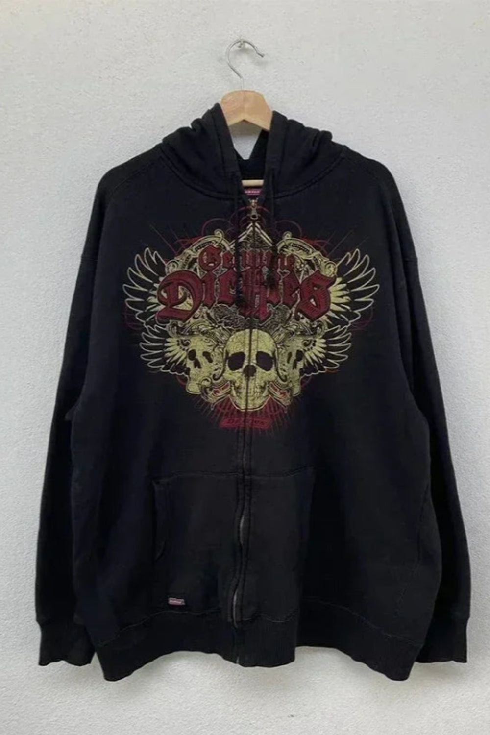 Black hoodie with a graphic design on a white background